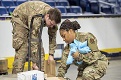 Louisiana Air National Guardsmen sort medical supplies at Smoothie King Center in New Orleans, March 31, 2020, while supporting COVID-19 response efforts. Medical supplies were stored at the sports arena before being distributed to drive-thru community-based COVID-19 testing sites. (Photo By: Air Force Senior Master Sgt. Dan Farrell)